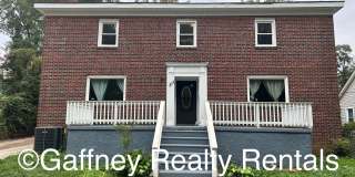 Spacious 4-Bedroom Brick Home with Hardwood Floors and Walk-In Closet Gallery 1