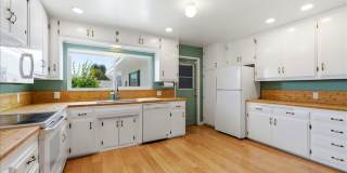 3 bed / 2 Bath Mid-Century Home with Two-Car Garage, Soaking Pool and Manicured Backyard! Gallery 1