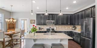 Like new gorgeous ground level Condo with Detached Garage and open floor plan. Gallery 19