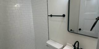 Rare 2-Full Bath Find: Pristine Renovation with Designer En-Suite & Granite Gallery 11