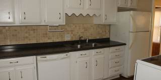 PRELEASING for AUGUST! Walk to Ball State! Spacious 4BR with Fenced Yard & Garage Gallery 1