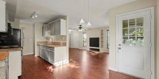 Spacious 2BR/2BA Corner Unit with Finished Basement, Private Patio & Garage Gallery 4