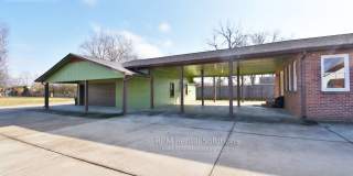 3BR/2BA one level, carport+detached garage/workshop, washer/dryer included, on 1.6 acres in M'boro! Gallery 1