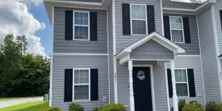 Featuring 2 bedrooms and 2.5 bathrooms. The main level features a welcoming living area, a kitchen with ample cabinet space, and a convenient half bathroom. Gallery 1