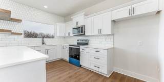 Single family home in Goddard Kansas. This home features 2 bedrooms, 2 bathrooms and a three car garage. Gallery 8