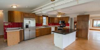 Bright, beautiful home with 3 garage spaces & tons of storage! Gallery 8