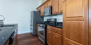 Gorgeous two bedroom two bath with 1574 ft. Two parking spaces included balcony, beautiful rooftop deck no pets. Gallery 5