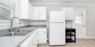 Discover the charm of this brick ranch nestled in the heart of Madison Park Gallery 11