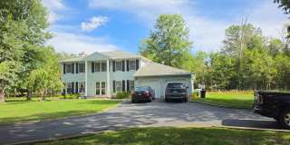 Centrally located, 4/5 spacious bedroom, 2.5 bathrooms, 2-car garage single family home with huge yard & lots of off-street parking! Gallery 1