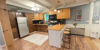 Beautiful Furnished Home with Cozy Rustic Finishes Gallery 1