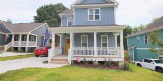 Charming 3 bedroom 2.5 bath home in incredible Durham location, with a massive fenced in yard! Gallery 1