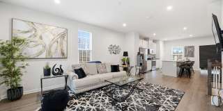 Welcome to this like new fully furnished home located in The Village at Courthouse Commons in Spotsylvania. Gallery 5