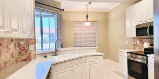 Experience Bell Tower Park. GATED ground floor 2 Bed 2 Bath Den 1 Car Garage Condo. Gallery 19