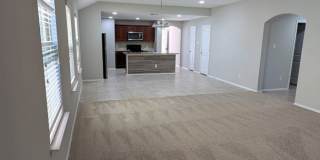 2 car garage with lighting, granite countertops. Backyard includes a custom extended concrete patio perfect for gatherings Gallery 28