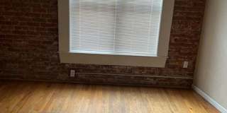 Large windows and exposed brick wall Gallery 6