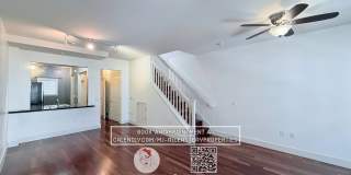 2-bed, 1.5-bath two-story condo, with rich hardwood floors, a modern kitchen, and spacious bedrooms with natural light. located above bustling Bay St. with shopping and restaurants steps away. Gallery 1