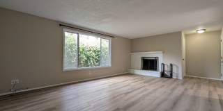 Bright 3 bedroom/ 1 bathroom Duplex with a fireplace and covered parking! Gallery 1