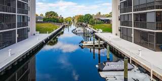 2BR/3BA Bonita Springs Waterfront Condo with Gulf Access, Boat Slips & Covered Parking — $2,500/mo Gallery 1