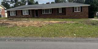 4bd 2ba All Brick Home with New Wood Floors & Large Fenced Yard Gallery 1