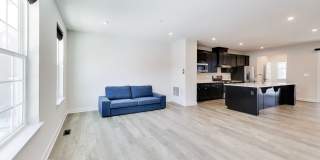 Welcome to this beautifully designed 3 level townhome in Westphalia Town Center Community! Gallery 7