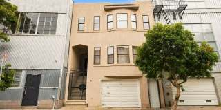 Spacious SOMA Flat - 2 Bed + Bonus Room, 2.5 Baths, Parking, Storage, Backyard Gallery 1