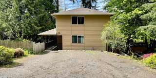 Large 2 Bedroom 2.5 Bath Home With Fenced Yard & Wrap Around Deck in Clearwood Community! Lake, Trails, Pool, Fishing! RV Parking! Gallery 1