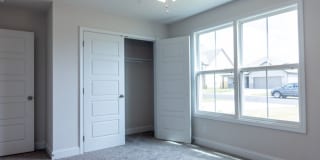 Modern Living Redefined with Stone Fireplace, Gray Cabinetry, Spa Inspired Primary Suite and Covered Outdoor Retreat Gallery 17