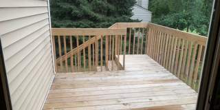 2 BR, 1.5 BA Clive split level duplex.  Deck and one car attached garage. Gallery 4