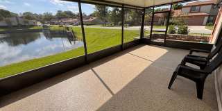 2 Bed 2 Bath Luxury Waterfront Townhome with Screened Lanai & Garage! 2 Bed 2 Bath Luxury Waterfront Townhome with Screened Lanai & Garage! Gallery 1