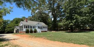 Charming 2 BD - 1 Full BA Home in Greer/Eastside close to Riverside HS, BMW, GSP, Inland Port, Greenville & Spartanburg but with country feel with land & outbuildings. The home sits on a 3/4-acre lot. Gallery 1
