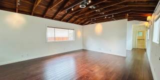 Spacious One Bedroom + Den Backhouse! In Unit Laundry! Prime Location! Gallery 1