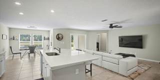 Beautiful Open Layout 4 Bed, 3 Full Bath | A True Masterpiece Backing to a Peaceful Pond with Modern Upgrades + Tesla Charging Gallery 10