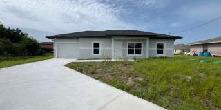 BRAND NEW MODERN SF HOME 3BD+den/2BA with GARAGE IN LEHIGH ACRES! Gallery 1