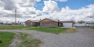 Spacious 3 Bed 2 Bath Brick Home with RV Parking, Shop Space & Large Yard in Tremonton! Gallery 1