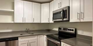 Huge 2 bed located near the Green Line with parking and in-unit A/C. Gallery 1