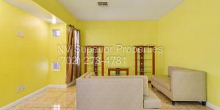 NW!! 4 Bedrooms!!! All Tile and Pergo flooring T/O!! NO Carpet!!! Low Maintenance Desert landscaping front and back!! With Patio cover in back!!! Gallery 15