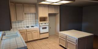 Bright & Inviting Home with Covered Patio, Gated Yard & Alley Access Gallery 1