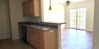3 bedroom, 2 bath condo with balcony, new floors, and new paint. Gallery 1