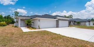NEW Villa-duplex home with quartz counters, 2-car garage, and a rear patio Gallery 1