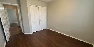 Single-level 3-bedroom home in a desirable Chandler location featuring a 2-car garage and tile roof and wood plank flooring throughout Gallery 30