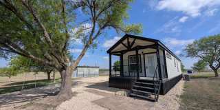 Tiny Home - Farmhouse Style/ Fridge, Washer & Dryer Included / Super Cute / Covered Front Porch Gallery 1