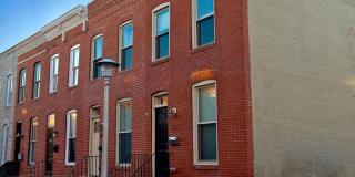 Charming 2 Bedroom/3 Bathroom Townhome w/ Den and In-Unit Laundry in Locust Point, MD! - Parking Pad! Gallery 1