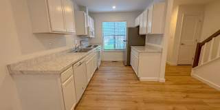 Welcome to this beautifully updated 2-bedroom, 2.5-bath lakeside condo in the highly sought-after Oaks of Avent Ferry community. Gallery 1