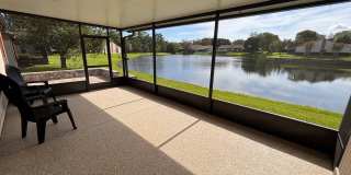 2 Bed 2 Bath Luxury Waterfront Townhome with Screened Lanai & Garage! 2 Bed 2 Bath Luxury Waterfront Townhome with Screened Lanai & Garage! Gallery 1