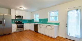 Discover the epitome of stylish living in this meticulously updated mid-century brick ranch, now available for rent. Gallery 10