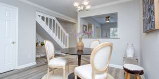 Discover this beautifully updated Raintree townhome featuring an open floor plan and a range of contemporary enhancements. Gallery 10