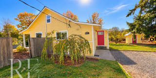 Whimsical Craftsman with Wraparound Porch, Bonus Room & Liberty Bay Peek Views Gallery 1