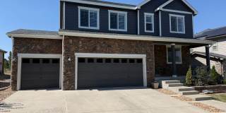 Greenbelt‑Backed Wheatlands Home - Mountain Views, 3 Car Garage & Finished Basement Gallery 1
