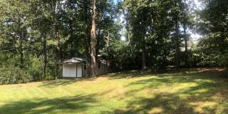 Travelers Rest !! 3 BR, 2 BA with Great Living Space - Den, Bonus Room, Primary Suite has a HUGE walk in Closet, Laundry Room, private screened in porch & deck AND a storage shed out back.  Fresh Paint and New LVP Floors Gallery 23