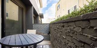 Welcome to 1823 N Fuller Ave 2 bed + 2.5 bath townhouse - where luxury meets serious style Gallery 21